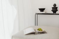 Kaboompics - Neutral Sofa Still Life with Magazine, Grapes and Black Decor