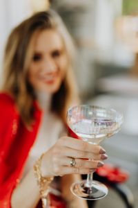 Kaboompics - Shallow-Focus Champagne Glass and Red Suit at New Year Party