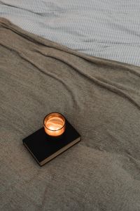 Kaboompics - Close-Up Candle on Gray Bedding
