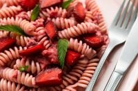 Kaboompics - Vibrant Pink Strawberry Pasta With Fresh Fruit Garnish