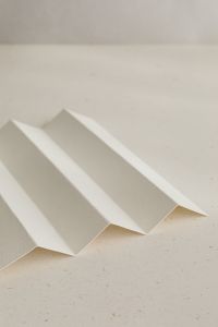 Kaboompics - Folded Paper Waves on White Surface