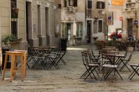 Kaboompics - Empty Sidewalk Cafe Tables Along a Sunlit Trieste Street