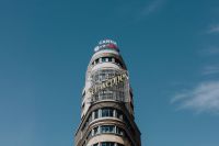 Kaboompics - Madrid Capitol Building with Schweppes Sign Beneath a Clear Blue Sky