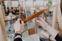 Kaboompics - Hands Weaving at a Wooden Loom