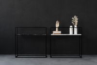 Kaboompics - Black Marble Console Tables Styled with Books, Ceramic Vases and Sculptural Hand Decor