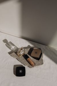 Kaboompics - Chanel No. 5 Perfume and Makeup on Marble Slab