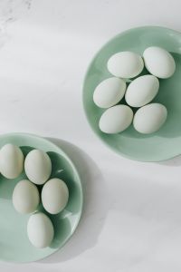 Kaboompics - Easter flat lay with green eggs on a white marble