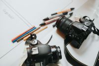 Kaboompics - Two DSLR Cameras with Colored Pencils on Creative Studio Desk