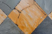 Kaboompics - Large Ochre Marble Slab Surrounded by Slate Gray Tiles, Naples Italy Geometric Floor Background