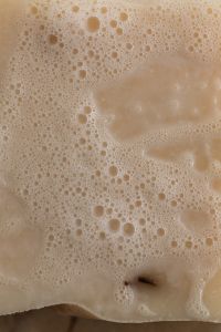 Kaboompics - Close-Up of Soap Foam and a White Bar