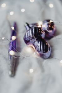 Kaboompics - Metallic Purple Bauble with Soft White Holiday Background