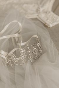 Kaboompics - Crystal Bridal Tiara Detail and Gold Rings on Linen