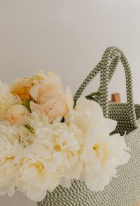 Kaboompics - Cream Flower Bouquet beside a Patterned Woven Bag