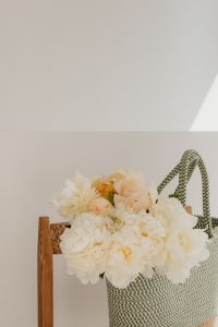 Kaboompics - White and Peach Flower Bouquet with Woven Tote and Copy Space