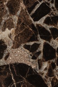 Kaboompics - Charcoal Stone Texture with Pale Mineral Threads and Rough Surface Detail