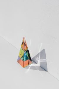 Kaboompics - Vertical Rainbow Prism Pyramid with Graphic Shadow and White Copy Space
