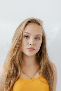Kaboompics - Tight Blonde Teen Portrait in a Yellow V-Neck Top