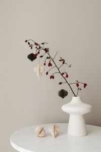 Kaboompics - White Christmas Display With Paper Ornaments and Red Berries