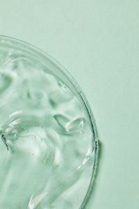 Kaboompics - Mint Green Skincare Gel Swatch with Air Bubbles in a Glass Dish, Macro Beauty Texture with Copy Space for Cosmetics