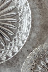 Kaboompics - Macro Crystal Glass Dish Details on a Neutral Gray Marble Background