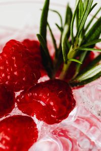 Kaboompics - Raspberries And Rosemary In Ice Water Macro