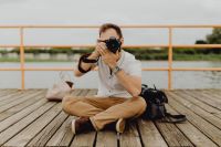 Kaboompics - Photographer holding a DSLR camera