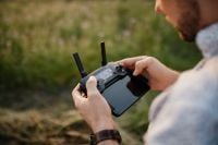 Kaboompics - Man holding remote controller for drones flying