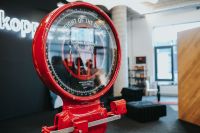 Kaboompics - Oversized Vintage Red Weighing Scale at a Design Exhibition, Industrial Installation Detail