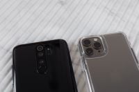 Kaboompics - Close-Up Pair of Smartphone Camera Lenses on Ribbed White Marble