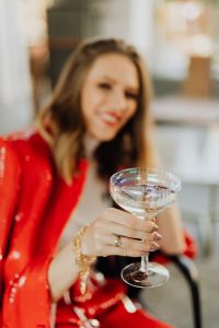 Kaboompics - Champagne Coupe Detail with Gold Bracelet and White Turtleneck