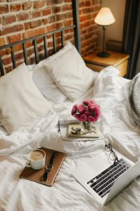 Kaboompics - Cozy Bedroom with Brick Wall, White Bedding and Morning Coffee