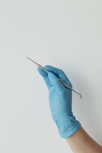 Kaboompics - Vertical Dental Explorer Instrument on White Background