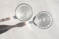 Kaboompics - Overhead Water Glasses Casting Shadows on White Marble