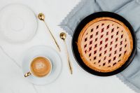 Kaboompics - Whole Blueberry Pie and Cappuccino on Blue Linen, Overhead Food Photo