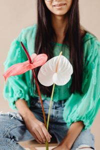 Kaboompics - A Beautiful Young Mixed Race Girl with Anthurium Flower