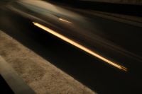 Kaboompics - Golden Motion Blur Light Trail over a Dark Urban Road
