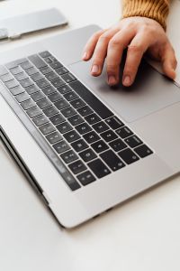 Kaboompics - Man works on a computer at his desk, mobile phone