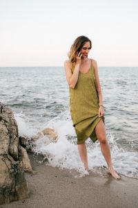 Kaboompics - Woman Enjoying a Phone Conversation by the Sea, Airy Green-Dress Summer Lifestyle