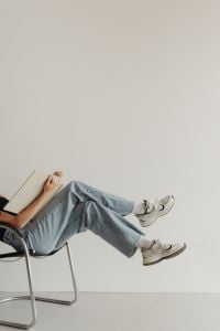 Kaboompics - Woman Reading with Wide Copy Space in a Minimal Home