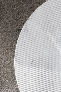 Kaboompics - Curved White Marble Tabletop beside Speckled Stone, Neutral Interior Texture for Home Decor