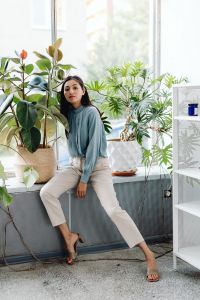 Kaboompics - Asian Woman Sitting Among Indoor Plants in a Bright Office