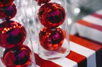 Kaboompics - Glossy Red Baubles Packed in Clear Tubes on a Festive Background