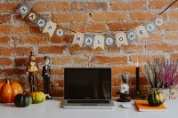 Kaboompics - Halloween Workspace With Laptop and Paper Garland
