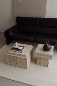Kaboompics - Black Leather Sofa with Wine Glasses and Travertine Decor