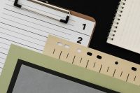 Kaboompics - Analogue Design Workspace with Clipboard Notebook and Layered Paper