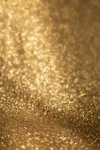 Kaboompics - Golden Glitter Backdrop With Radiant Bokeh and Reflective Surface
