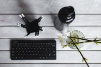Kaboompics - Overhead Office Desk Flat Lay with Pencils, Bottle and Glass Vase
