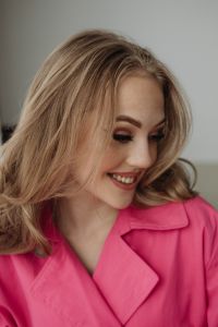 Kaboompics - Smiling Woman in Bright Pink Blazer
