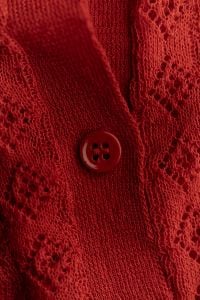 Kaboompics - Red Knitted Textile With Button and Pattern
