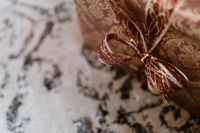 Kaboompics - elegantly wrapped gifts with golden ribbon